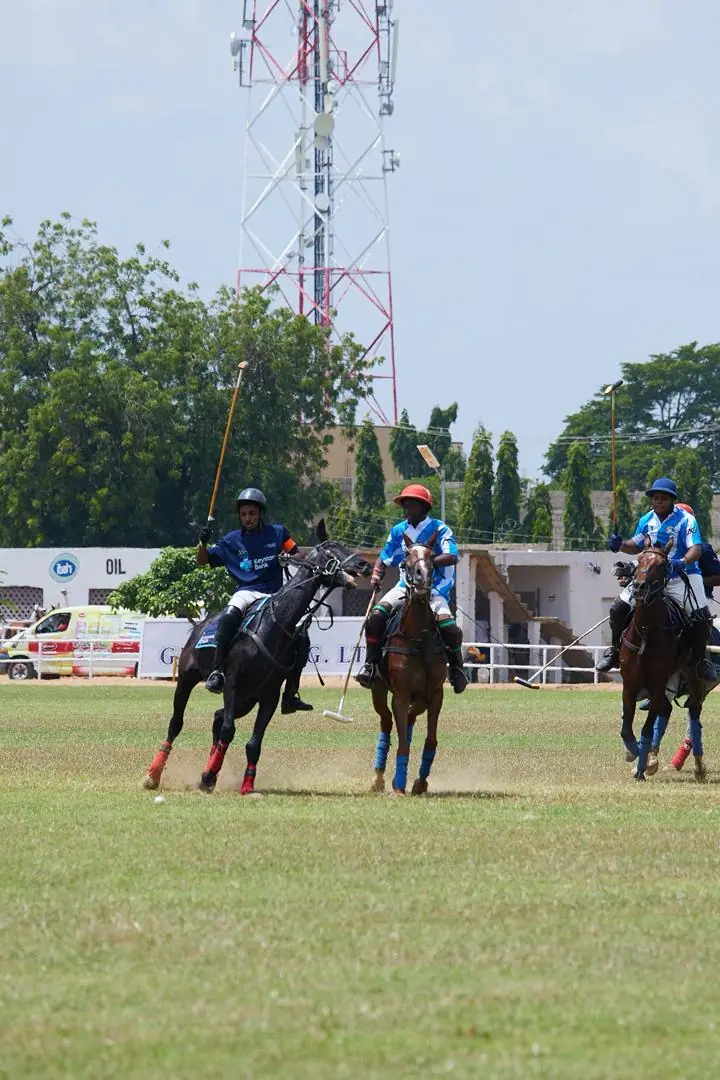 Keystone polo match in play, with riders chasing the ball across the field
